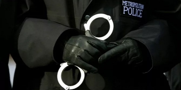 329_met police cuffs.jpg